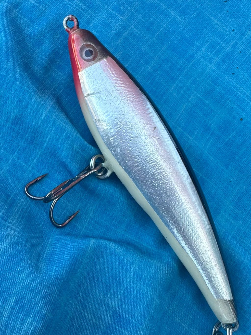 Proto 02 from above — red head, silver foil back, twin trebles